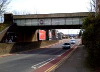 Just South of the T-junction at the East end of the station, that increasingly rare feature - an advertisement on a bridge girder. How handy it would be, if you were driving through Gloucester and had a sudden urge to buy a reducing valve, to have this large arrow pointing you towards a factory producing that very same commodity! Having said that, if you followed the arrow and found that the factory had been demolished and replaced by housing, you might find the address of the new owners - also in Gloucester - a bit more useful.<br><br>[Ken Strachan 31/03/2013]