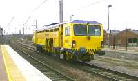 Tamper DR 73920 passes Warrington Bank Quay on 18 April 2013 heading for Springs Branch.<br><br>[Ken Browne 18/04/2013]