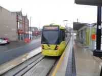 A Metrolink tram calls at Rochdale railway station on 23 April 2013.<br><br>[John Yellowlees 23/04/2013]