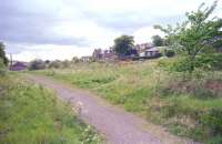 The site of Leslie Station looking west in 1997. Much of the former railway land has now been given over to housing, although part of the old goods yard remains to the east [see image 4030]. <br><br>[Ewan Crawford //1997]