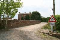 The road approach to the former Ruthwell station in May 2008. Located on the G&SW route midway between Dumfries and Annan the station closed to passengers in 1965. [See image 19346]<br><br>[John Furnevel /05/2008]