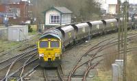 Freightliner 66548 with the 4S42 Fiddlers Ferry to Hunterston high level sidings empties passing Arpley Junction on 18 April 2013.<br><br>[Ken Browne 18/04/2013]