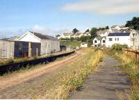 Scene at Instow, North Devon, on the Barnstaple - Torrington line. View north towards the level crossing in 1990. Instow station closed to passengers in 1965, with the line from Barnstaple closing completely in 1982. [See image 19737] [With thanks to all who responded to this query]   <br><br>[Ian Dinmore //1990]