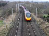 Southbound 11-coach Pendolino crossing the M6 Motorway at Clifton and Lowther, just to the south of Penrith, in February 2013.<br><br>[Mark Bartlett 04/02/2013]