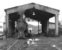 At Oskova washery on the Banovici coal railway in Bosnia, ex JZ 760mm gauge 0-8-2 No. 83.159 runs through the unloading shed as it heads back to the sidings to pick up another load of coal. Normally the coal is unloaded into the left hand bunker and the empties, having been drawn through to the far side are then propelled back on the right hand line to be picked up by a class 740 diesel. The operation is quite slick and the diesel will already have coupled on and departed for the mine. <br><br>[Bill Jamieson 12/03/2013]