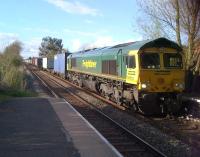 Freight as far as the eye can see - Freightliner 66572 coasts down the incline from the summit near Johnson's Road towards Coventry on 26 April.<br><br>[Ken Strachan 26/04/2013]