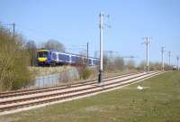 Parallel lines. 170 410 west of Saughton past the nearly complete section of Edinburgh Tram route on 30 April.<br><br>[Bill Roberton 30/04/2013]