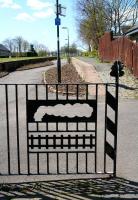 Nice touch. Part of the <I>themed</I> metal barrier separating Bonnyrigg station and the B704. View south west over the station towards Rosewell on 30 April 2013.<br><br>[John Furnevel 30/04/2013]