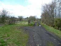 View north towards Canonbie station, Rowanburn, on the Langholm branch on 4 May 2013. The branch trackbed is on the left with the old route into Canonbie Colliery on the right.<br><br>[Bruce McCartney 04/05/2013]
