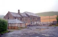 The Newtyle Chemical Company building to the east of Newtyle station, photographed in 1998 looking south east. The works was rail served via a turnplate siding. Hatton incline was off to right. The structure has since been demolished and houses now stand on the site.<br><br>[Ewan Crawford //1998]