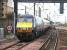 A morning GNER Kings Cross - Glasgow Central service pulls away from the Haymarket stop in August 2006 and immediately turns left onto the Carstairs line at Haymarket East Junction. The train will make one further call at Motherwell (to set down) before reaching its ultimate destination.<br><br>[John Furnevel 05/08/2006]