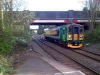 The 18.53 service to Nuneaton approaches Bedworth through encroaching vegetation on Friday 26th April. <br><br>[Ken Strachan 26/04/2013]