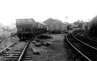 Probably the last wagons to use the goods yard and coal drops at Bedale, as this picture was taken four days before official closure here and at the similar one at Leyburn. Limestone and military traffic continued to Redmire of course, long enough for the line to pass into preservation as the Wensleydale railway. The then closed passenger station can be seen to the right with level crossing and signal box just out of sight around the curve. <br><br>[Mark Bartlett 27/05/1982]