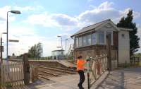 Heather closing the level crossing gate at Shippea Hill in May 2011.<br><br>[Ian Dinmore /05/2011]