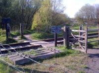 Appearances can be deceptive. This location on the Chasewater Railway in Staffordshire seems to be a beautifully preserved pedestrian crossing; but two railways (colliery lines) once crossed on the level here. The trespass notices carry the name <I>Chasewater Light Railway</I>.<br><br>[Ken Strachan 05/05/2013]