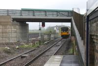 Electrification preparations at Salwick have also seen the Up side bridge being removed. This used to span three tracks and although its replacement is shorter it has still left space for two tracks should these be required in the future. Pacer 142014 hurrying through on a Blackpool North to Manchester Victoria service is a reminder that the wires can't come soon enough for this line.<br><br>[Mark Bartlett 11/05/2013]