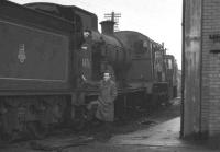 Locomotives stabled alongside the shed at Stirling South in 1959 include ex-Caledonian 4-4-0 no 54476, withdrawn from here in March 1960. The smiling face looking back from the footplate belongs to Robin Barbour.<br><br>[K A Gray //1959]