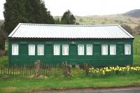 Old railway carriage incorporated into the body of a roadside house east of Fintry, Stirlingshire, photographed in May 2013.<br><br>[Colin Martin 08/05/2013]