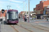 More <I>future proofing</I> on the Blackpool tram system. These points and crossover are intended to create the south to east chord of a triangular junction with a branch that will run along Talbot Rd to Blackpool North railway station. There were no funds for that at the time but when it is built the costs, and disruption to existing services, will be considerably reduced by the trackwork having been already installed. <I>Flexity</I> 010 slows for the North Pier stop on its way to Fleetwood in May 2013.  <br><br>[Mark Bartlett 14/05/2013]