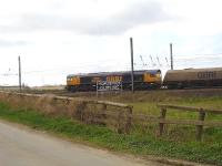 GBRf 66706 runs south past the <I>Edinburgh 200 miles</I> sign at Shipton, north of York, on Sunday 5 May 2013. The loaded coal wagons are destined for Drax power station.<br><br>[David Pesterfield 05/05/2013]
