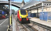 Scene on the 'sub' platforms on 17 May 2013 with work well advanced on the new canopies. View from the car park as the Virgin Trains 06.19 ex-Birmingham New Street runs into platform 8.<br><br>[John Furnevel 17/05/2013]