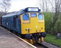 A train stands at the platform at Oakworth on 27 April 2013. On the front is preserved diesel locomotive 25059.<br><br>[Colin Alexander 27/04/2013]