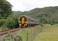 Kyle of Lochalsh bound 158707 heads away from the camera after calling at Attadale Halt with an afternoon service from Inverness in July 2012. Taken from the north (sea loch) side, with the A890 road on the other side of the line. <br><br>[Mark Bartlett 11/07/2012]