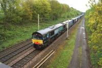 A DRS Daventry - Coatbridge container train heading north at Charnock Richard on 18 May 2013 behind 66427.<br><br>[John McIntyre 18/05/2013]