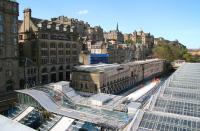 Work in progress on the south side of Waverley station on 17 May 2013 - looking west. The sweeping roof of the new Market Street entrance can be clearly seen, with covered stairways running off towards the station car park (left) and sub platforms 8 & 9, where work is well underway on the new canopies. Far right is a section of the recently reglazed roof of the main station.<br><br>[John Furnevel 17/05/2013]