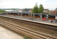 The 16.40 Grand Central service for London Kings Cross ex-Bradford Interchange lays over for 7 minutes at Wakefield Kirkgate's reordered island platform 3 on 20 May. The train will shortly head via Pontefract Monkhill and the Askern line to reach its next stop at Doncaster.<br><br>[David Pesterfield 20/05/2013]