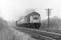 40169 east of Wennington station on 27 March 1982 with an eastound short train of chemical tanks. The tanks had no doubt originated at ICI Heysham and would probably be heading for Teesside.<br><br>[Bill Jamieson 27/03/1982]