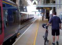 Two units and a bike. From left to right, that's the 20.00 to Oxford, the shuttle to Ealing Broadway, and who knows where the chap in the shorts is going. Reading station is much bigger and brighter than it used to be - as it should be, given the money spent!<br><br>[Ken Strachan 18/05/2013]
