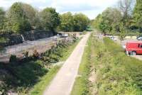 View north from the B6392 road bridge towards Glenesk Junction in May 2013, with the site of Glenesk Colliery and sidings on the left. Near the green barrier stood Glenesk station, which first appeared in timetables in 1855 (although its opening date is shown by both Butt and Cobb as 1858). The station (occasionally shown as Glenesk Junction) seems to have officially closed in 1874, though it continued in use (unadvertised) into the 1880s.<br><br>[John Furnevel 22/05/2013]