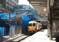 Looking west along platform 8 at Waverley on 17 May 2013 as the 12.43 arrival from Helensburgh Central prepares to leave as the 13.07 to Milngavie.<br><br>[John Furnevel 17/05/2013]