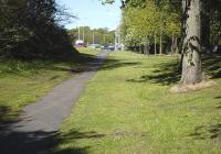 View east along the former course of Randolph Road and the Wemyss Tramway (closed 1932) in Kirkcaldy on 25 May 2013, with the modern-day road diverging in the background.<br><br>[Bill Roberton 25/05/2013]