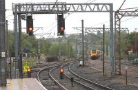 Compared with the north end of Lancaster station, the jumble of catenary, masts and gantries at the south end makes conventional photographs quite difficult. 221105 <I>William Baffin</I> approaches on a Birmingham New St to Edinburgh service on 24 May 2013.  <br><br>[Mark Bartlett 24/05/2013]