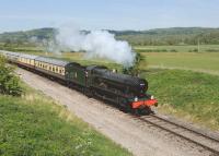 Scene on the Gloucestershire Warwickshire Railway on 26 May as 7903 <I>Foremarke Hall</I>, departing from Toddington for Cheltenham, is seen passing close to Hailes Abbey.<br><br>[Peter Todd 26/05/2013]