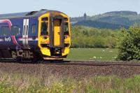 An Alloa Glasgow Queen Street service approaches the location of the former Bannockburn station on May 25th 2013. The Wallace Monument provides the backdrop. The station may yet be resurrected as a Park and Ride facility for Stirling, though probably under the name of <I>Stirling Parkway</I> or similar.<br><br>[Mark Dufton 25/05/2013]