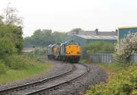 DRS 37609 and 37612 have just reversed in Morecambe and now head for Heysham Power Station with their single flask wagon. The single track branch only has limited train movements nowadays, a far cry from the double track electrified days that ended in 1966.<br><br>[Mark Bartlett 28/05/2013]