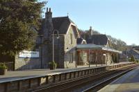 Lit by oblique sunlight on the morning of 13th April 2002, the up side main station buildings at Grange over Sands are just what one would hope to find at such a resort. A secondhand book-shop (with a worthwhile selection of railway books at the time of my visit) is located inside.<br><br>[Bill Jamieson 13/04/2002]