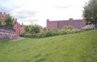 View south at the former Partick North Junction in 1997 [see image 52289]. Behind the camera a tunnel runs north to Crow Road, while the Meadowside Granary dominates the centre of the photograph. This location was part of a triangular junction, with Partick West station standing on the south east corner. Partick West had platforms on the north to east curve, handling services between Maryhill and the city centre, as well as on the east to west route, catering for trains running between Glasgow and Dumbarton.<br><br>[Ewan Crawford //1997]