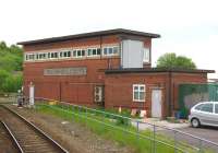 The signal box at Wigan Wallgate, standing between the lines to Southport and Crosby just west of the WCML. Photographed in May 2013 from a passing Southport to Wigan train.<br><br>[John McIntyre 29/05/2013]