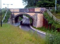 Comparing this recent picture to four years ago [see image 26247], it is clear that a great deal of remedial brickwork has been carried out on this bridge at Trumpington, as well as laying the surface of the Guided Busway beneath it. View looks towards Cambridge in June 2013.<br><br>[Ken Strachan 08/06/2013]