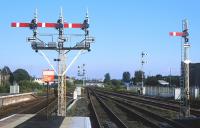 Waiting for an Edinburgh train at Stirling on the evening of 8th August 2002, the collection of semaphore signals at the south end of the station is perfectly illuminated by the lowering sun.<br><br>[Bill Jamieson 08/08/2002]