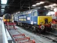 Emblazoned DRS West Coast Thunderbird 57307 <I>Lady Penelope</I> stabled at Euston on 5 June alongside London Midland EMU 350255 on the rear of the 12 car 16.50 departure to Northampton boarding at platform 16.<br><br>[David Pesterfield 05/06/2013]