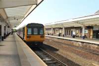 The rather ordinary looking canopies and building exteriors at Middlesbrough station conceal a very impressive booking hall and concourse that are worth a second look. Northern Pacer 142026 departs on a Saltburn to Bishop Auckland service.<br><br>[Mark Bartlett 06/06/2013]