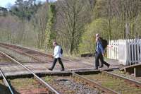 Passengers for a westbound Furness Line train risk life and limb accessing the down platform at Kents Bank station in April 2002. Long may this fit-for-purpose situation remain! <br><br>[Bill Jamieson 13/04/2002]