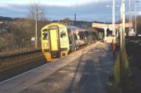 The late afternoon sun catches 158752 as it departs from Sowerby Bridge on 12 March 2013 on a Leeds to Manchester Victoria service.<br><br>[John McIntyre 12/03/2013]