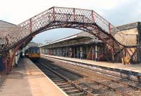 Refurbishment work at Hexham means the NER footbridge is out of use at present with its temporary replacement further along the platforms. Pacer 142071 is newly arrived on a Northern service from Middlesbrough via Hartlepool and will shortly return there departing from this westbound platform via a crossover.<br><br>[Mark Bartlett 06/06/2013]