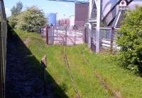 Here's where all that avgas goes every Thursday: looking into the Rolls-Royce civil aero engine test beds tank farm on 25 May 2013 from the passing UK Railtours 'Whitehouse Wanderer'.<br><br>[Ken Strachan 25/05/2013]